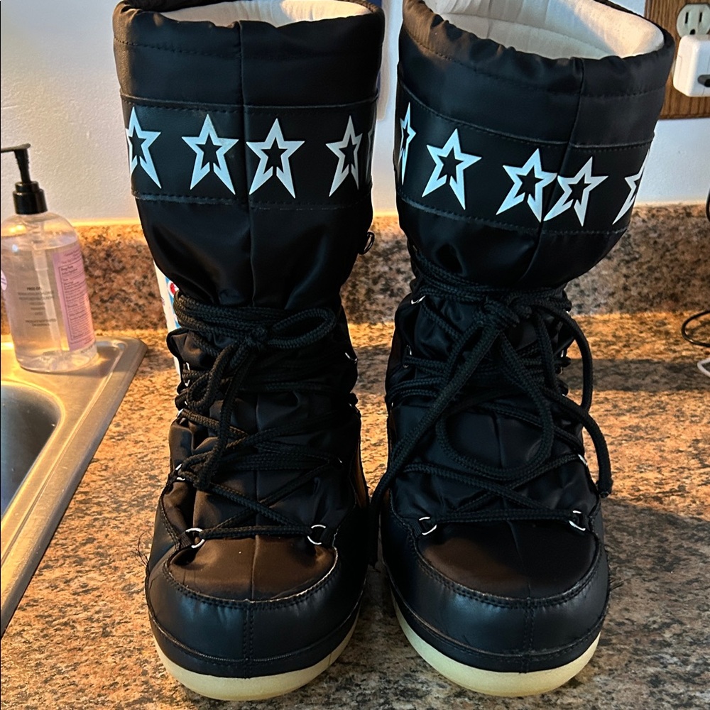 Stylish black Moon Boots size 7